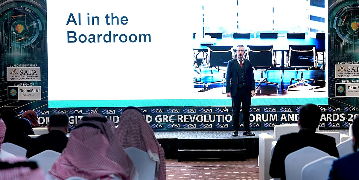 Dr. Tim Nedyalkov presenting at a boardroom session in Riyadh