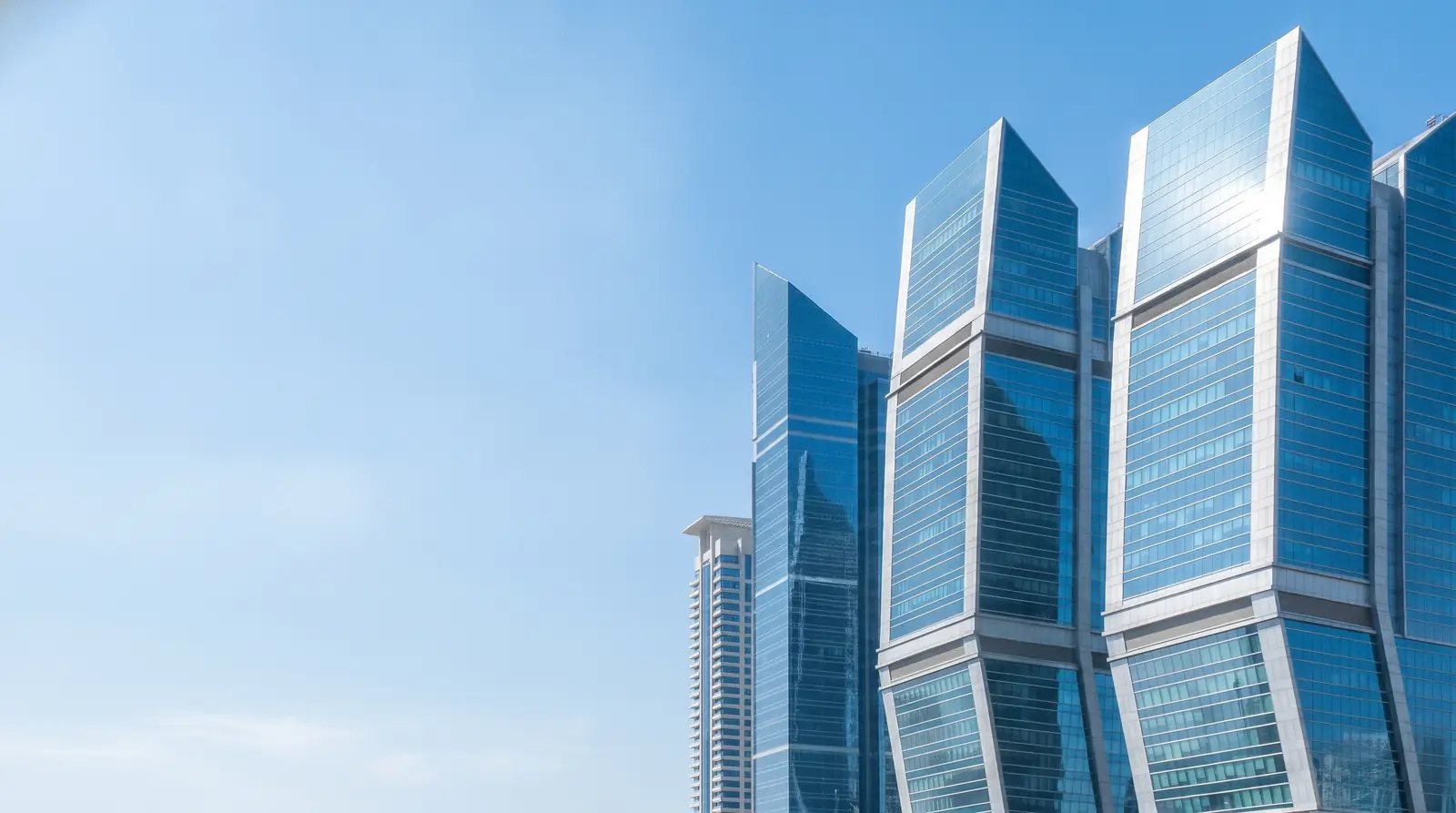 Modern Gulf business-district skyline at midday